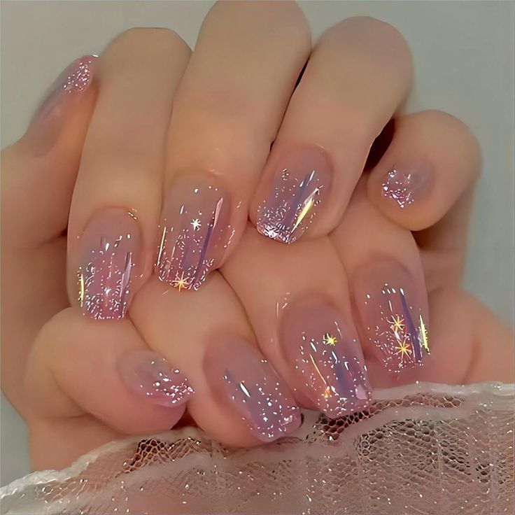 Ethereal Ombre Nail Design with Glittery Accents and Whimsical Elegance.