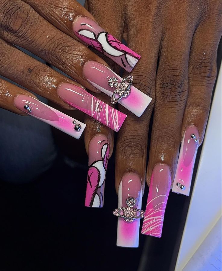 Vibrant Pink and White Nail Design with Intricate Patterns and Elegant Embellishments