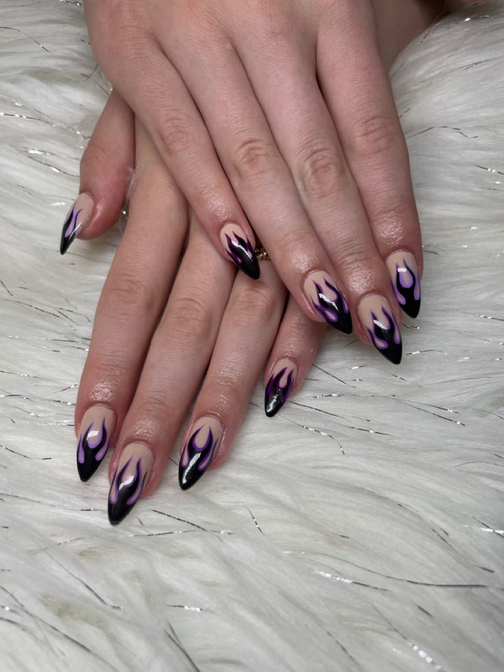 Edgy Flame-Inspired Gradient Nail Design with Bold Black Tips and Vibrant Motifs.