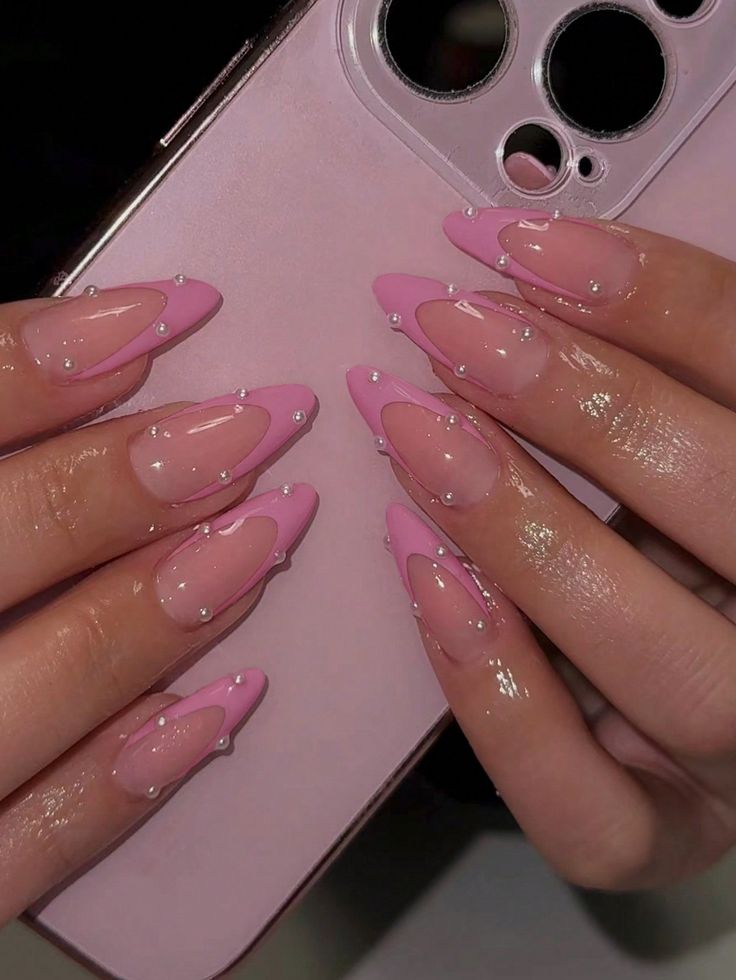 Chic Pink Nail Design with Glossy and Matte Finishes, Pointed Tips, Rounded Base, and Pearl Embellishments.