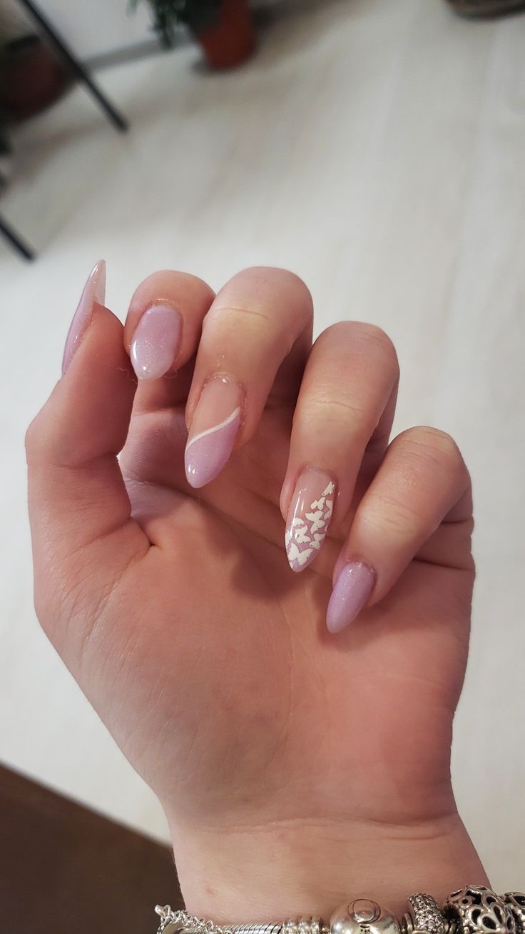 Elegant Soft Pink Nail Design with Creative Negative Space and Structured Tips.