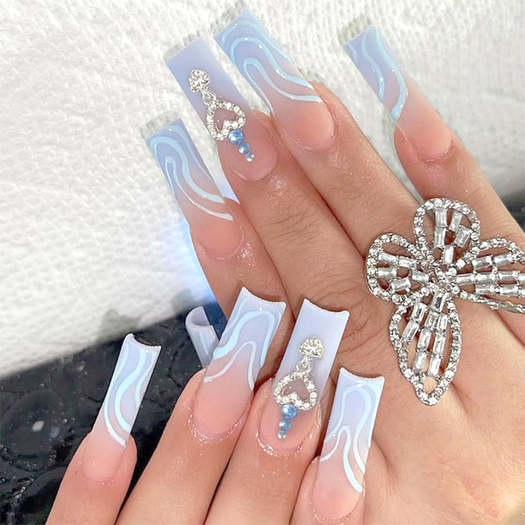 Sophisticated Serene Nail Design: Soft Blue and White Swirls with Sparkling Embellishments for Special Occasions