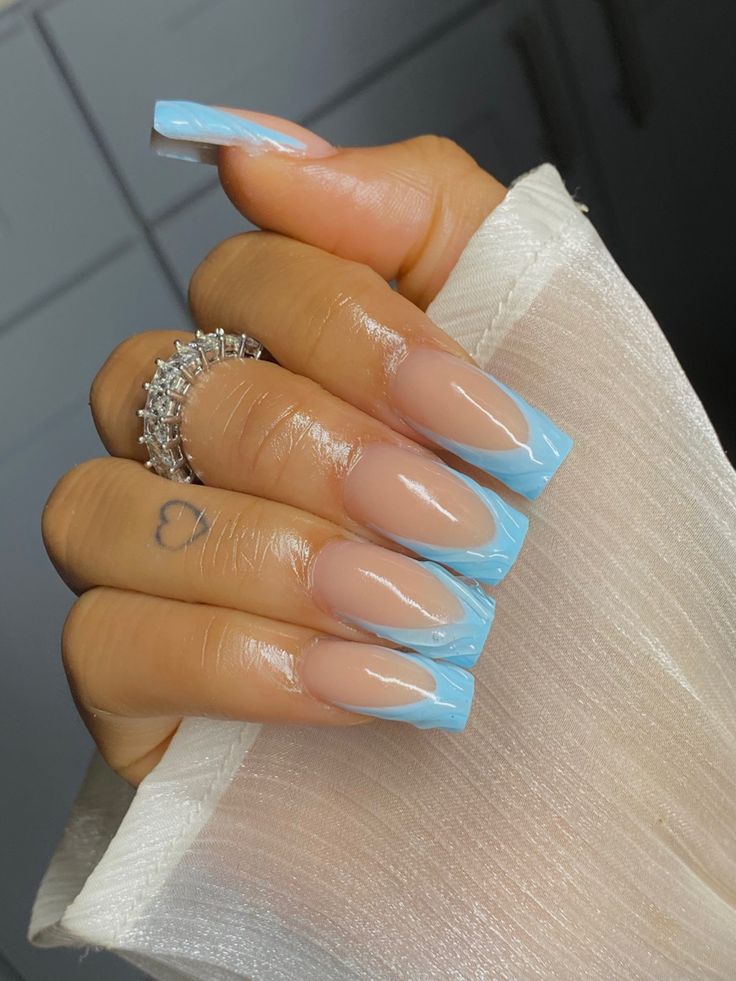 Chic Long Squared Nail Design in Soft Nude and Pastel Blue with Glossy Finish.