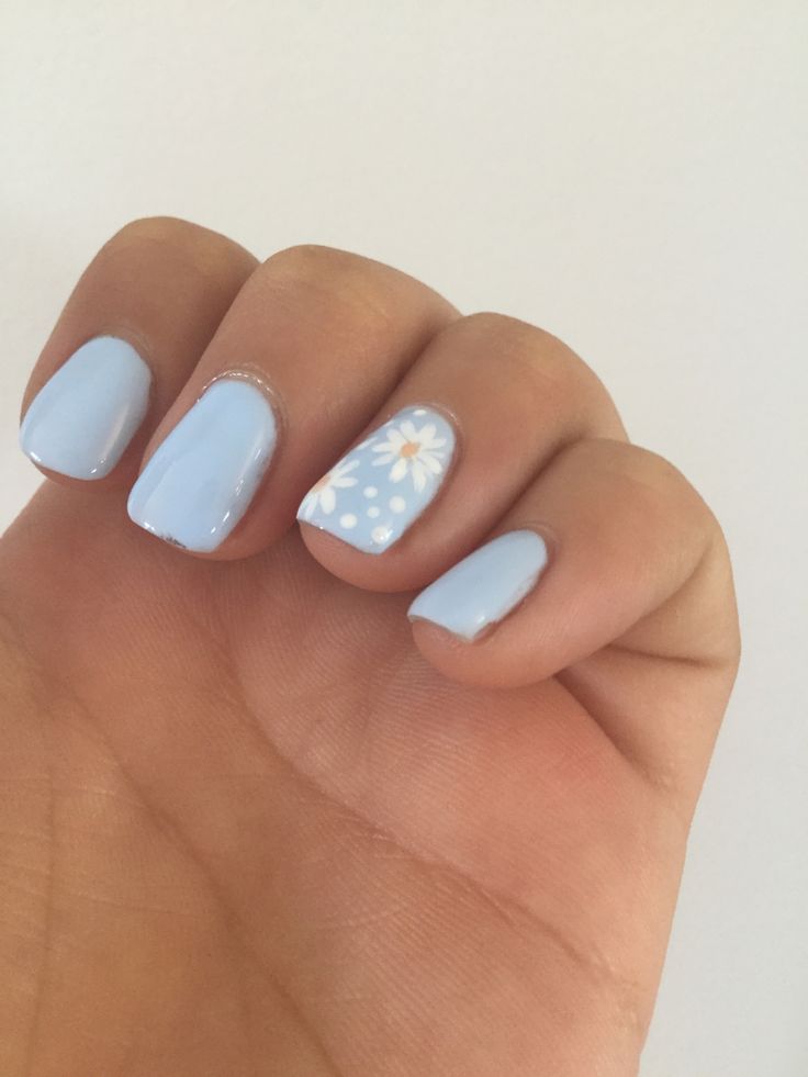 Charming Soft Blue Nail Design with Whimsical Floral Accent