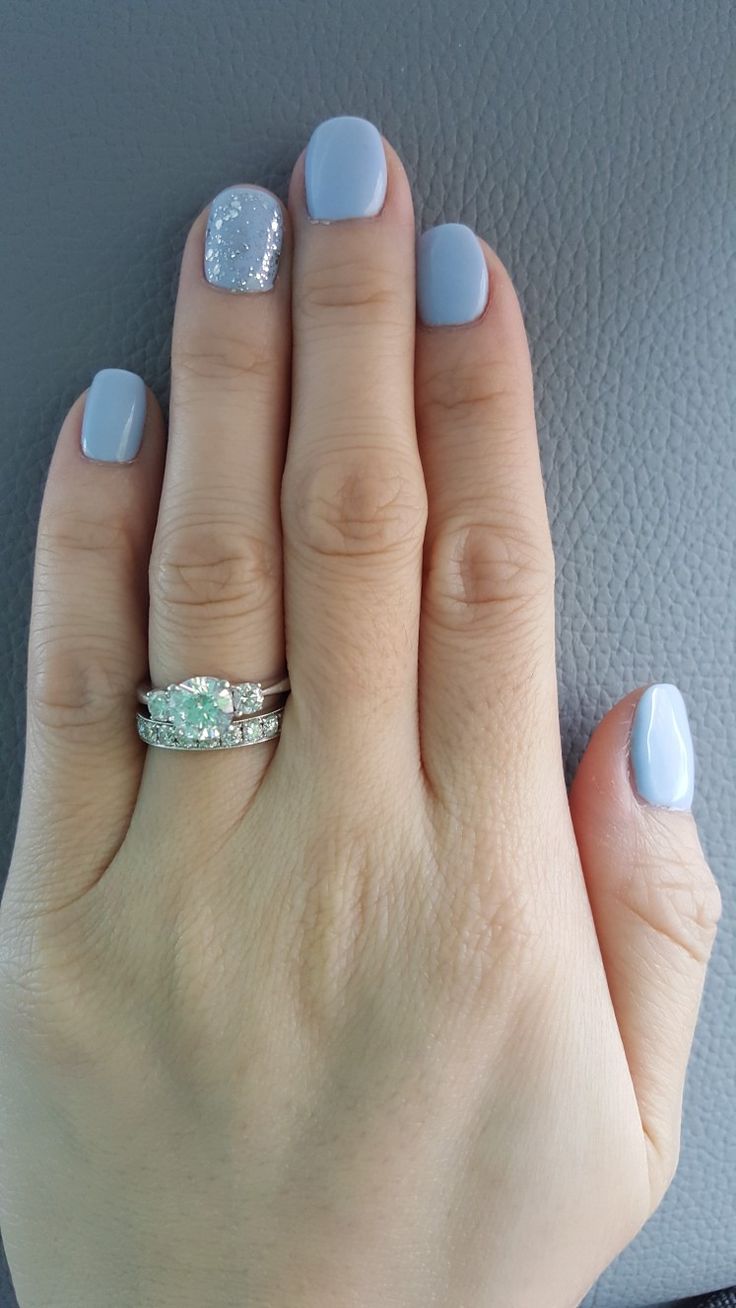 Sophisticated Lavender Nail Design with Glitter Accent and Elegant Ring.