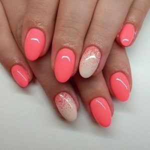 Vibrant Coral Nail Design: A Sleek Blend of Solid and Gradient Finishes with Elegant Glitter Accents.