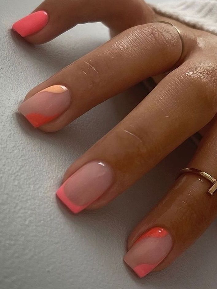 Vibrant Peach and Pink Nail Design with Unique Patterns and Gradients