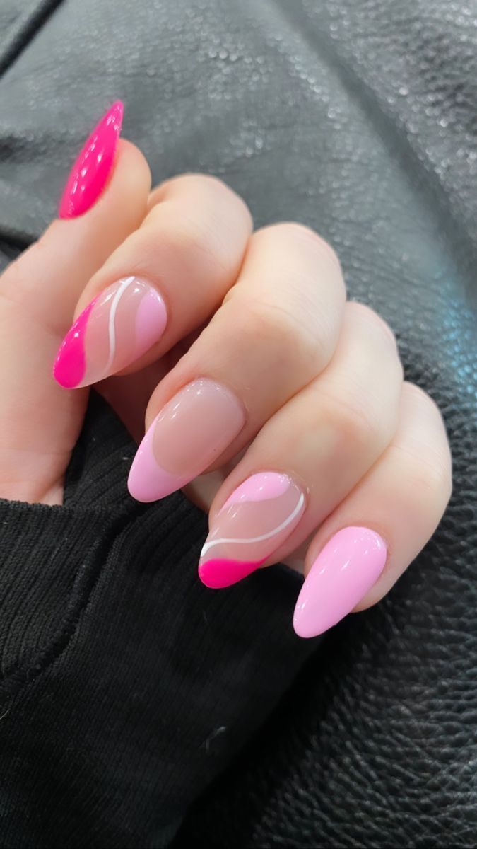 Playful Almond-Shaped Nail Art: A Trendy Mix of Colorful Pink Shades and Swirls