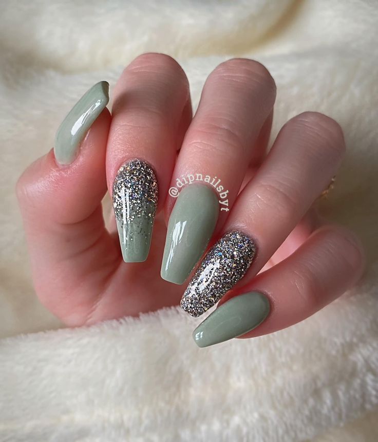 Chic Soft Green Nail Design with Sparkling Silver Glitter Accents.