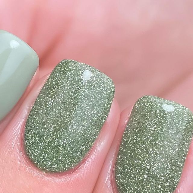 Chic Nature-Inspired Textured Green Nail Design with Matte and Glitter Finishes.