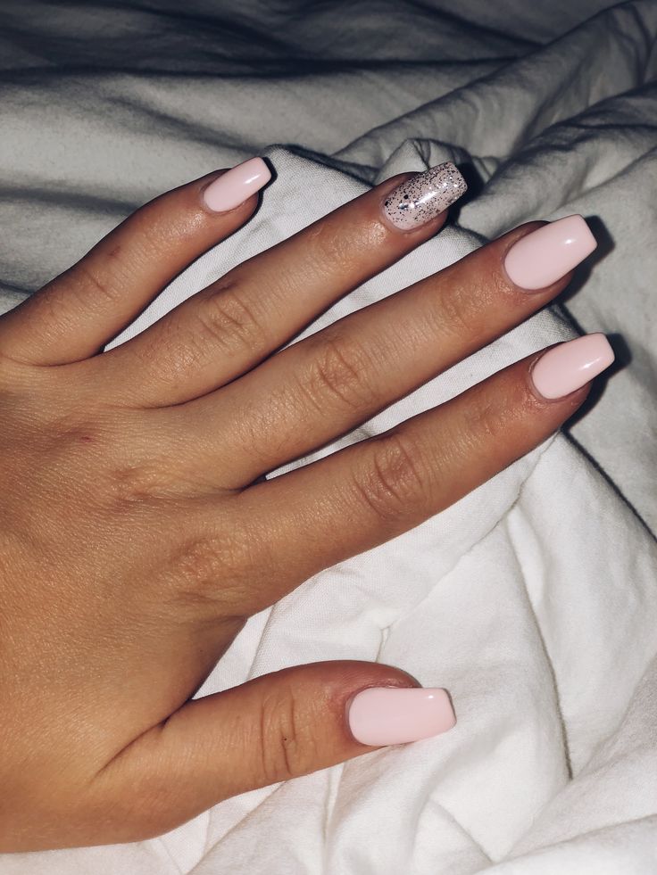 Chic Soft Pink Nail Design with Glamorous Silver Glitter Accent.