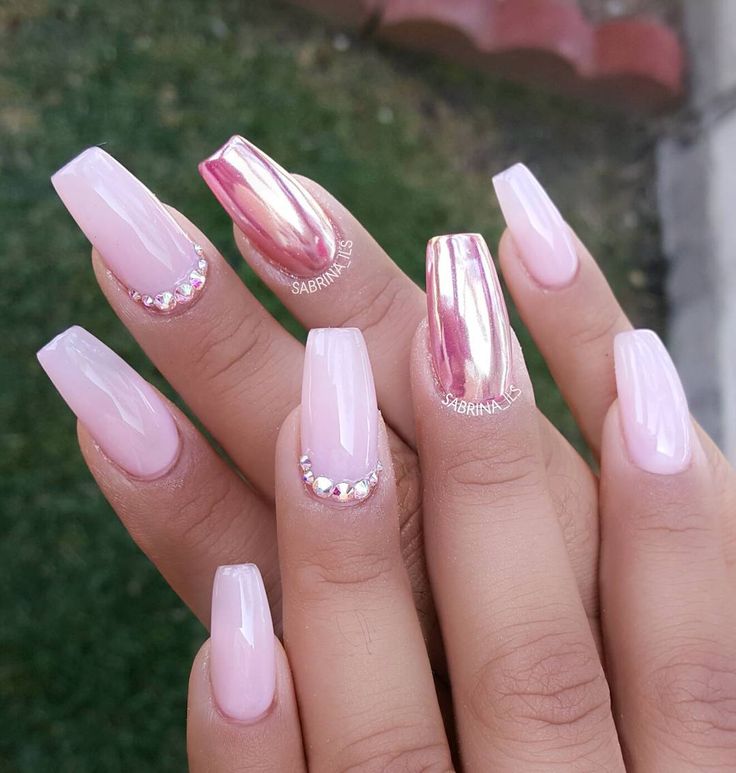 Elegant Soft Pink Nail Design with Glossy Finish and Glamorous Rose Gold Accents.