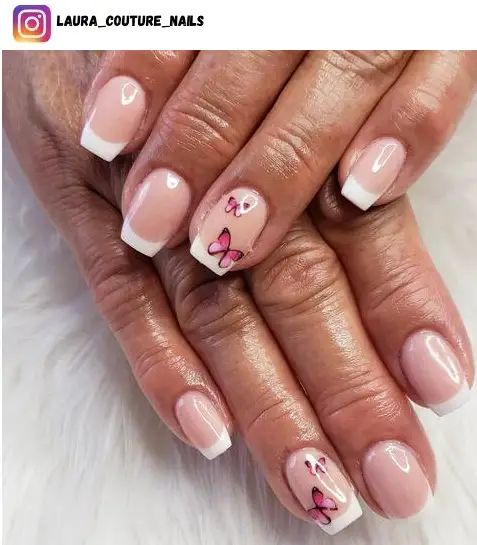 Sophisticated Nail Design: Nude Pink Base with Classic French Tips and Whimsical Butterfly Accents.