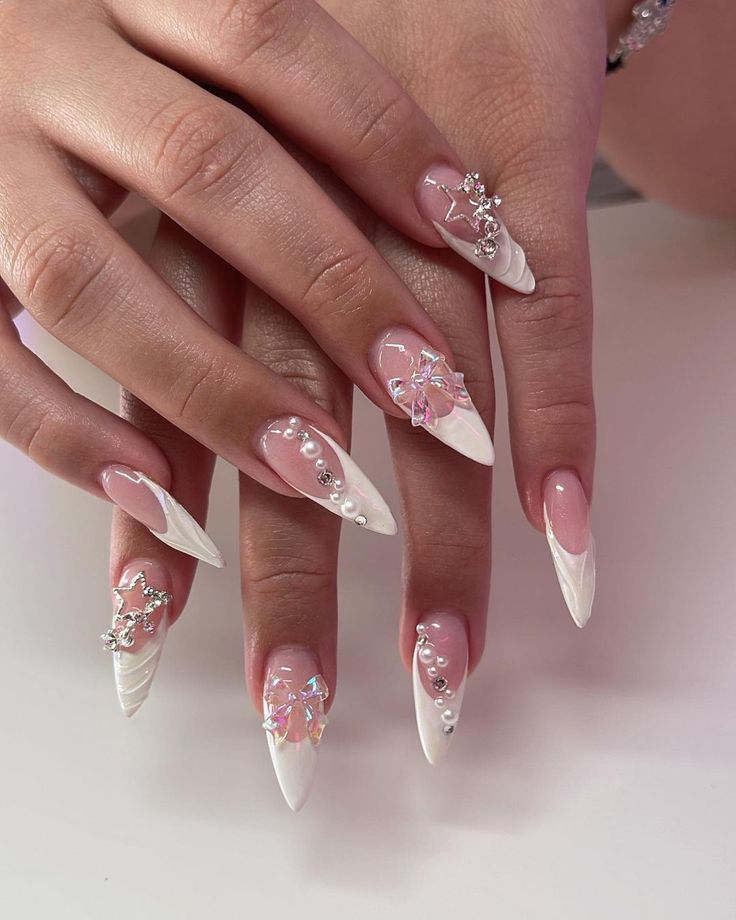 Elegant Claw-Shaped Nails Featuring Intricate Designs and Modern Accents