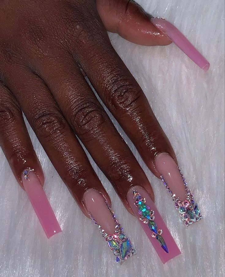 Glamorous Soft Pink Gradient Nail Design with Colorful Rhinestone Accents.