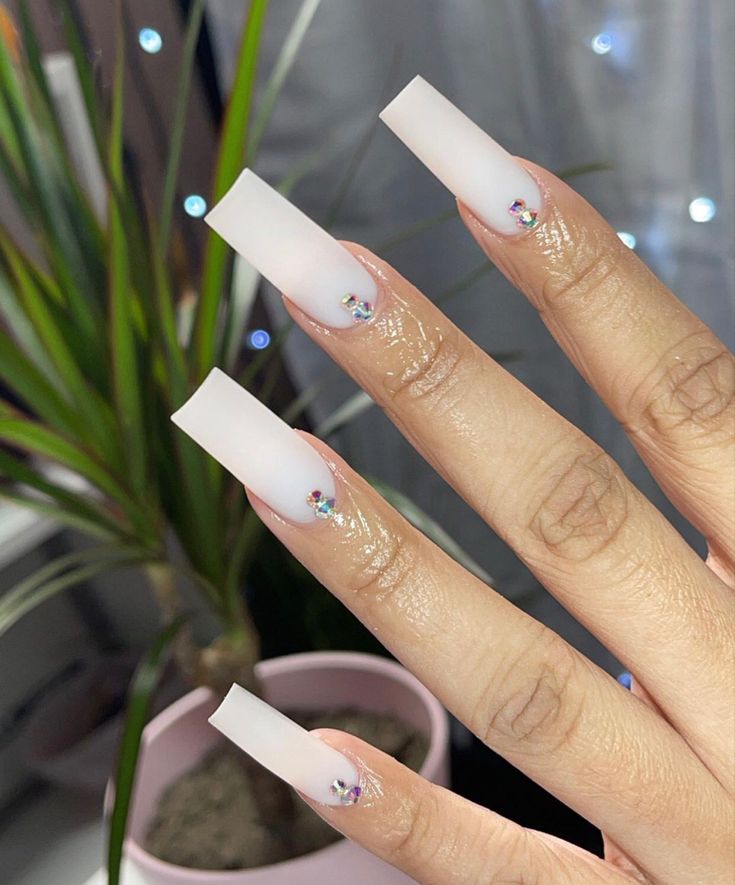 Sophisticated Long Matte Nails Enhanced with Shimmering Rhinestones