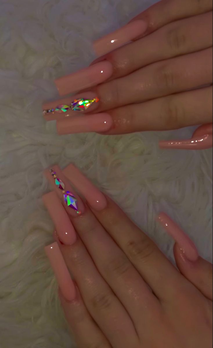 Chic Long Nails with Glossy Pink Polish and Iridescent Gem Accents