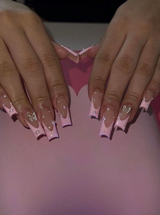 Chic Long Square Nail Design with Soft Pink Base, Elegant White Tips, Pearls, and Golden Accents.