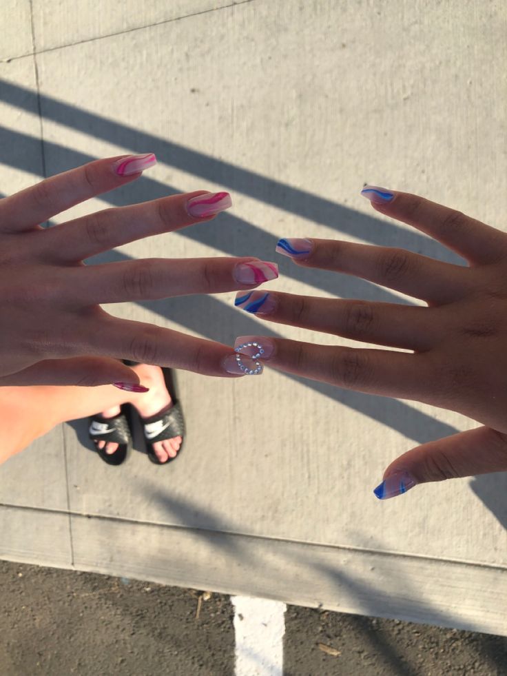 Vibrant Nail Designs: Playful Patterns and Sparkly Elegance for a Fun Summer Look.