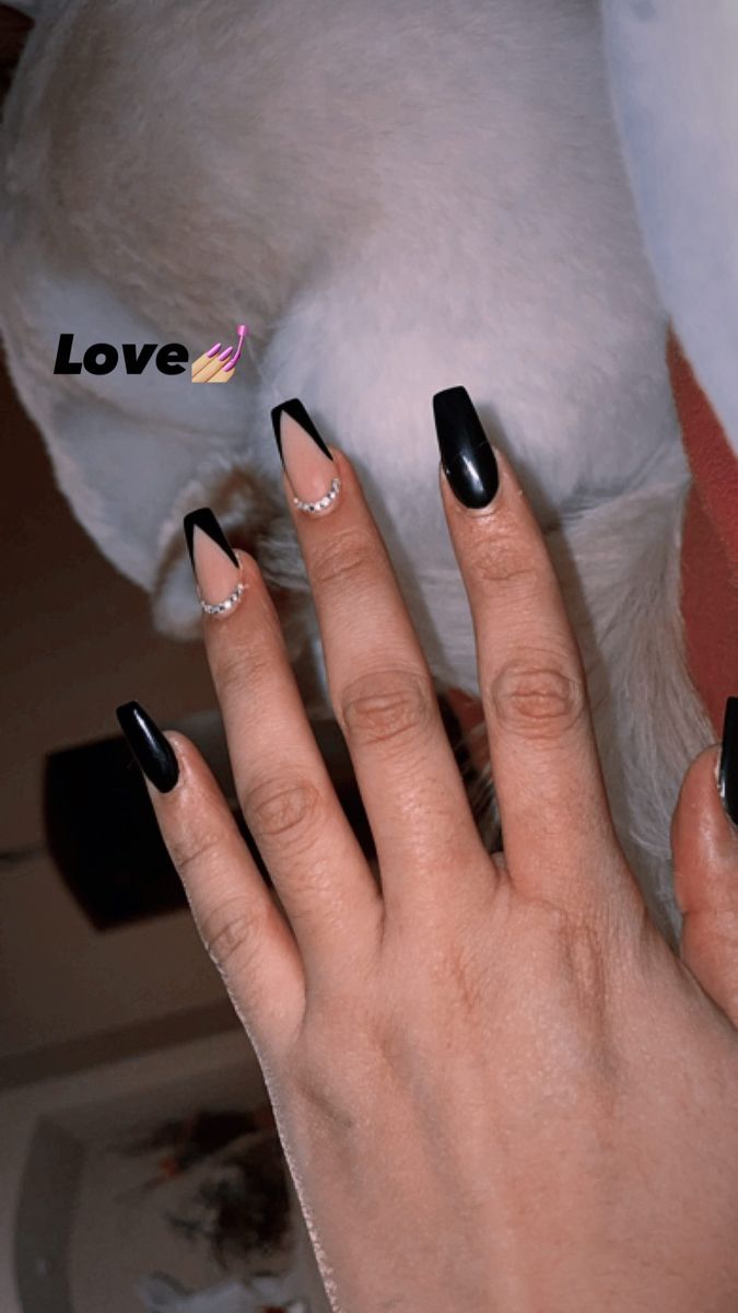 Chic Black and Nude Nail Design with Rhinestones: A Perfect Blend of Boldness and Sophistication.