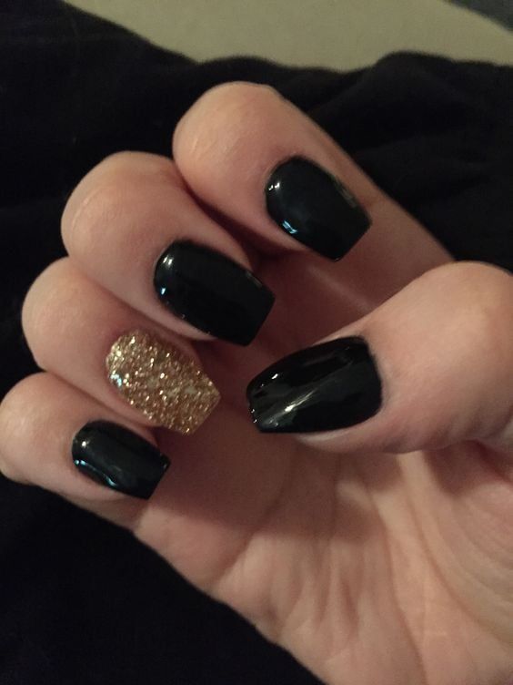 Sophisticated Black Manicure Accented with Glamorous Gold Glitter