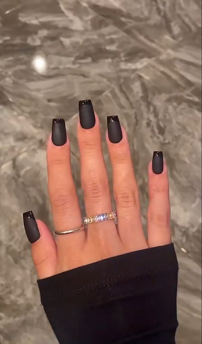 Elegant Matte Black Nails: A Modern and Versatile Statement with Subtle Embellishments.