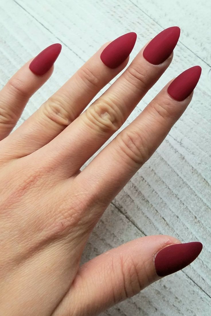 Sophisticated Almond-Shaped Nails in Deep Burgundy Matte: A Chic Manicure for Every Occasion.