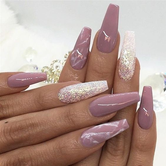 Sophisticated Mauve Nail Design with Shimmering Accents and Marble Effect.