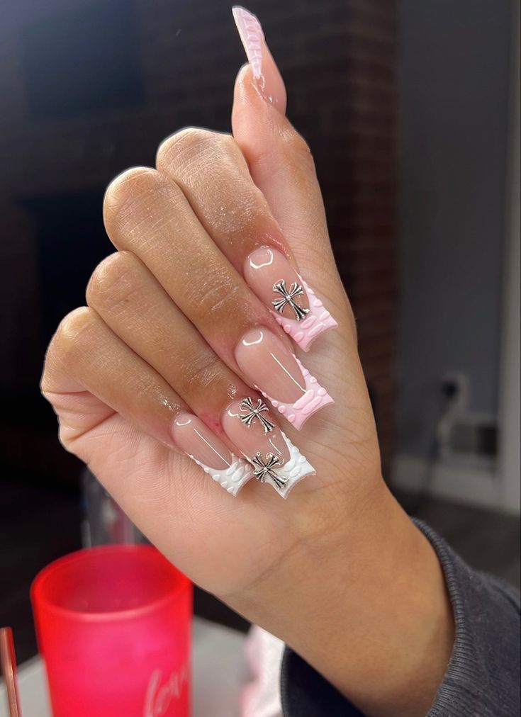 Sophisticated Elegant Nail Design with Soft Pink, White Hues, and Intricate Silver Floral Accents.