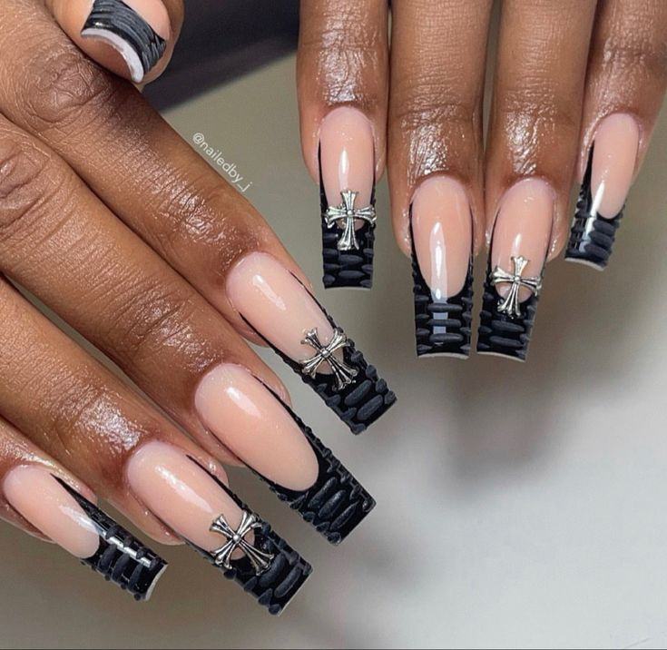 Sophisticated Nude and Black Nail Design with Textured Pattern and Silver Embellishments.