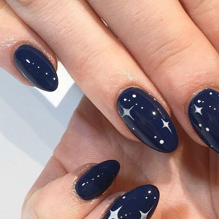 Elegant Celestial Nail Design with Navy Base and Sparkling Stars