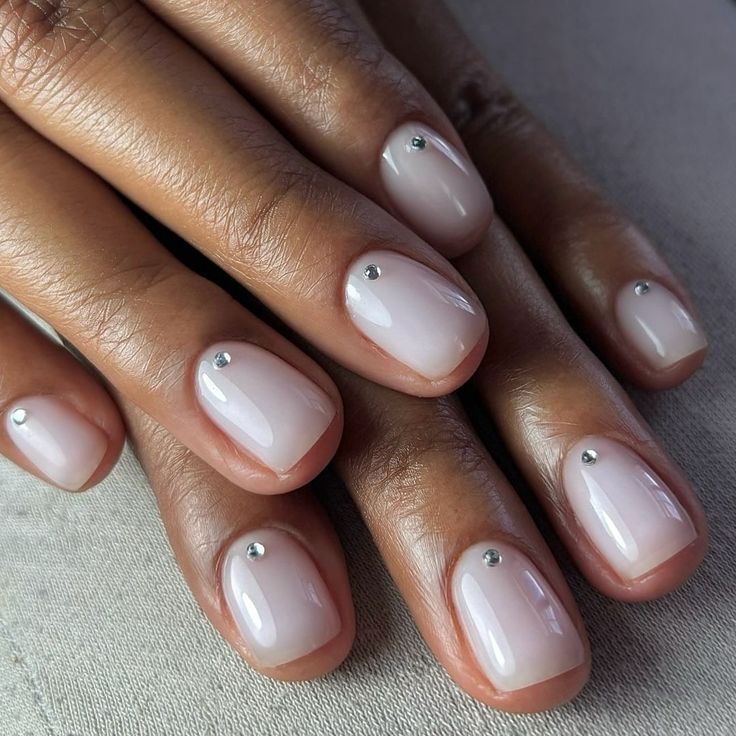 Chic Nude Nails with Metallic Studs: A Versatile Elegance for Any Occasion.