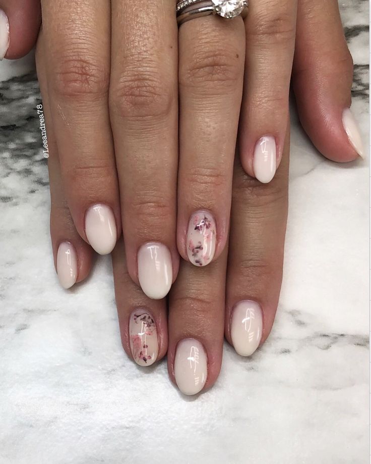 Elegant Soft Nude Nail Design with Glossy and Matte Finishes and Floral Accents