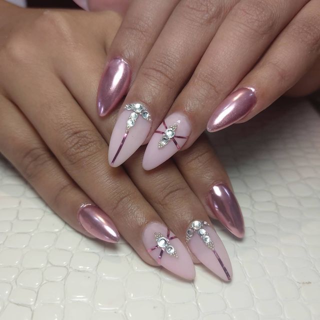 Chic Almond-Shaped Nail Design with Glossy, Matte Finishes and Sparkling Embellishments.