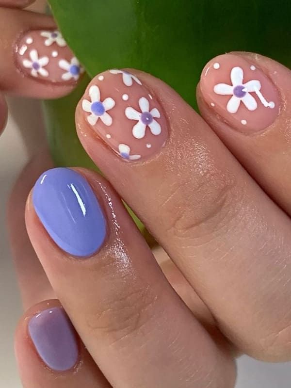 Playful Spring Nail Design with Soft Pastels and Floral Patterns