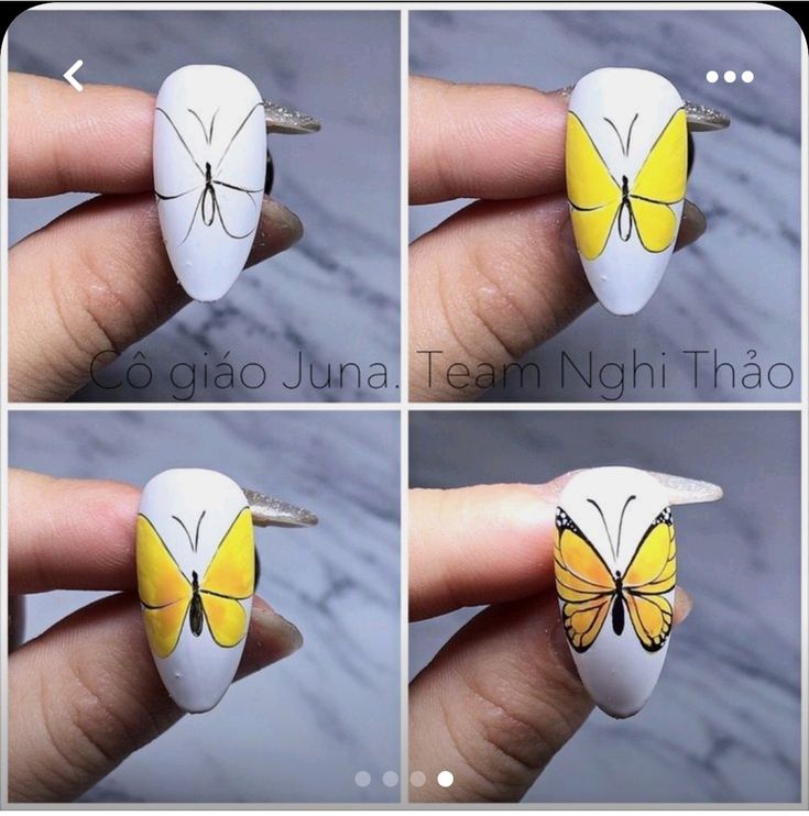 Elegant Butterfly-Inspired Nail Design with Yellow and Black Accents on a White Background.