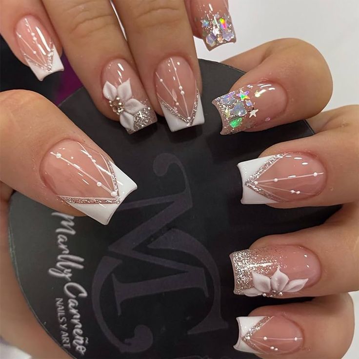 Chic French Tip Nail Design with Floral Accents and Geometric Elegance.