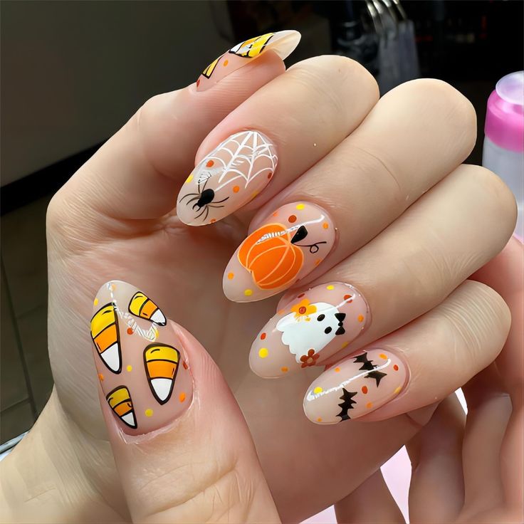 Whimsical Halloween Nail Design with Candy Corn, Spiders, and Cute Ghosts