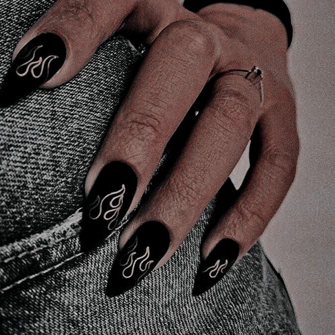 Dramatic Bold Black Flame Nail Art with Intricate White Detailing for an Edgy Look.