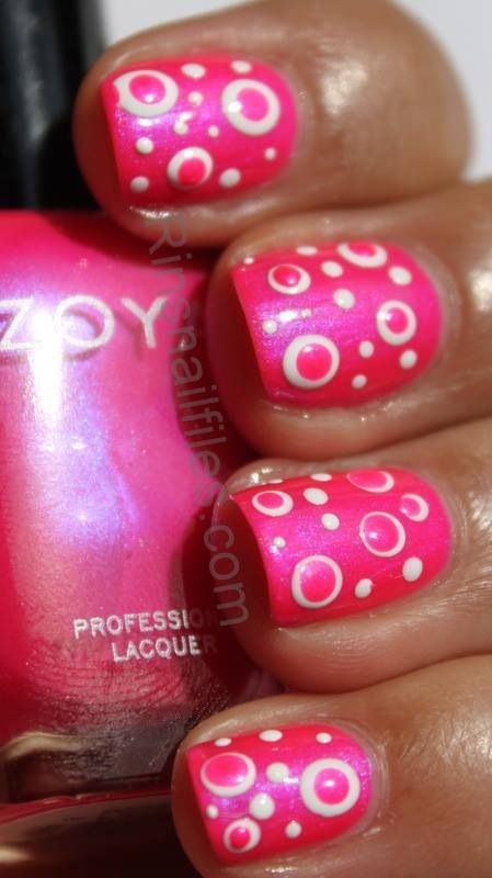 Playful Polka Dot Pink Nail Design for a Whimsical Summer Look.