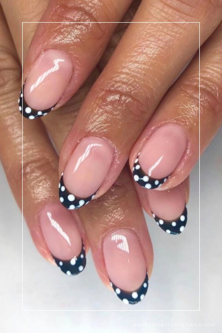 Chic French Tip Nail Design with Bold Navy and Playful Polka Dots