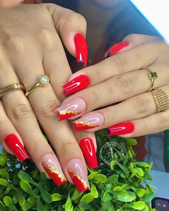 Striking Red and Nude Nail Design with Elegant Gold Accents