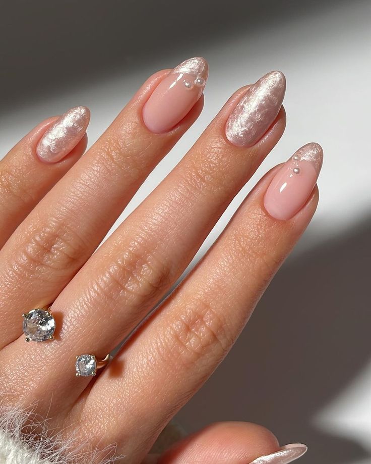 Sophisticated Elegant Nail Design: Soft Pink Base with Shimmering Silver Tips and Tiny Pearl Accents.