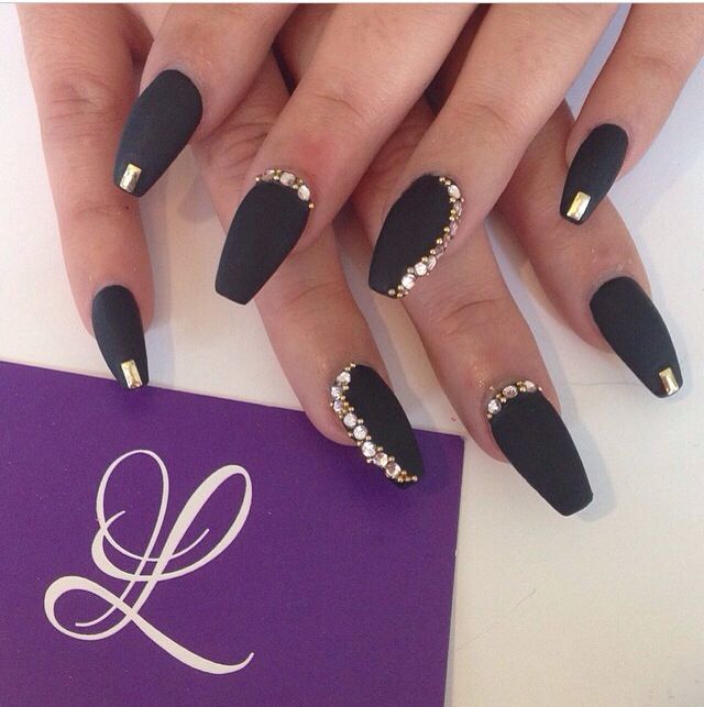 Sophisticated Matte Black Nails with Metallic Accents and Glamorous Rhinestones