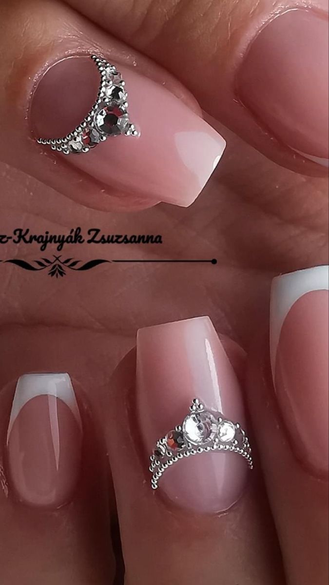 Chic Soft Pink French Tip Nails Enhanced with Delicate Rhinestones for Timeless Elegance.