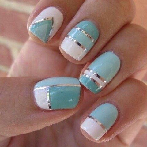 Chic Geometric Nail Design in Soft Turquoise and White with Metallic Silver Accents.