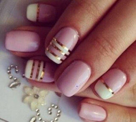 Elegant Pastel Nail Design with Gold Accents for a Modern Twist.