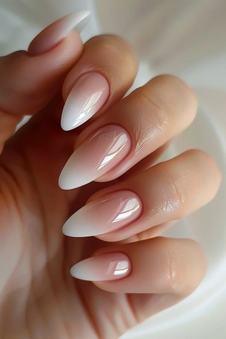 Chic Ombre Almond Nails: Timeless Elegance from Soft Pink to Crisp White.