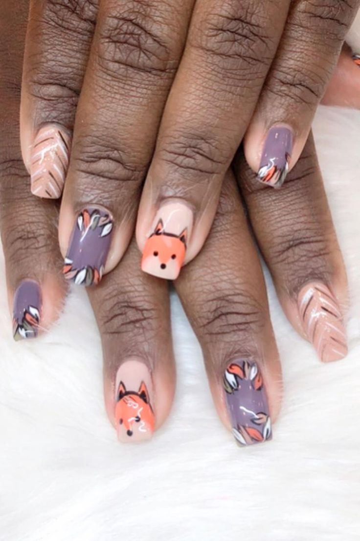 Playful Fox Accent Nail Design in Deep Purple and Soft Nude with Floral Patterns.