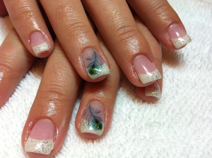 Sophisticated Nail Art: Clear Polish, White Tips, Sparkling Glitter, and Colorful Swirls.